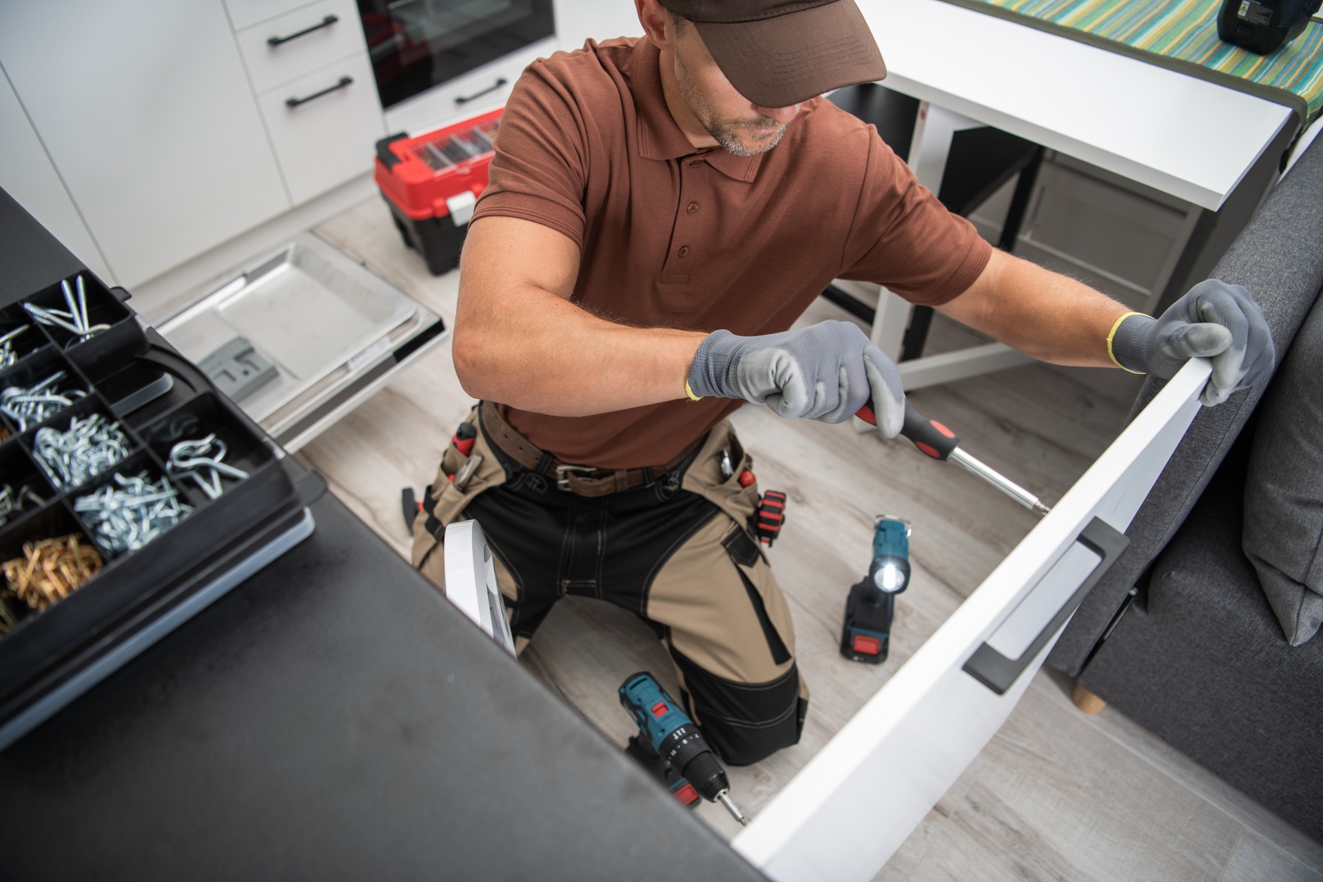 Handyman Doing Kitchen Furniture Installation